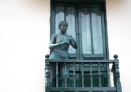 Nude woman on balcony
