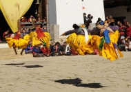 4 monks jumping (back view)